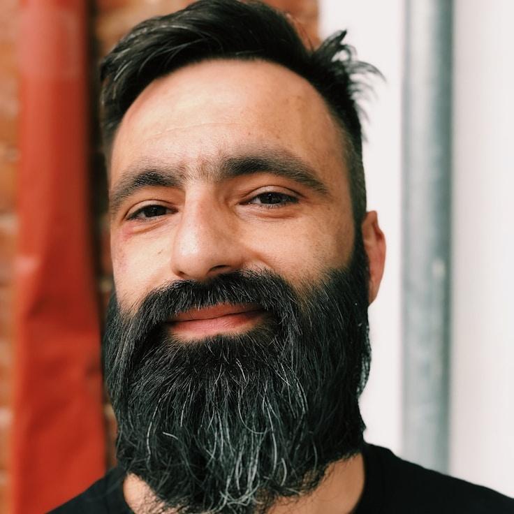 Kaveri Mehta, Lead Design Curator at ChapterDriftNarrow, reviewing corporate floral arrangements